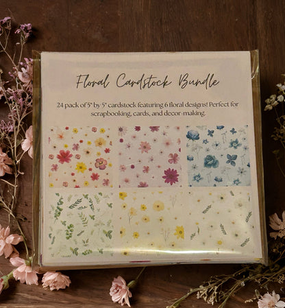 Floral cardstock bundle packaging with floral designs on a wooden surface.